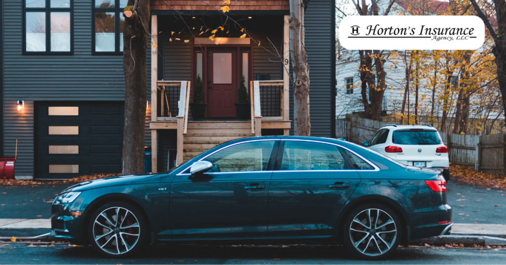 Car parked in front of a residential home representing bundled home and auto insurance coverage